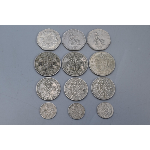 124 - A Sheet of 12 Assorted UK Coins. Includes Three 50p's, Three Half Crowns, Three Florins and Three Si... 