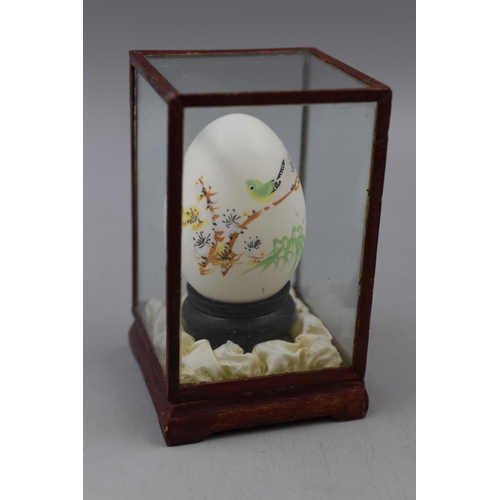 194 - Selection of 7 Cases containing Hand painted eggs in Various Designs