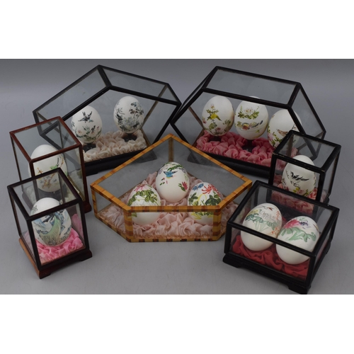 194 - Selection of 7 Cases containing Hand painted eggs in Various Designs