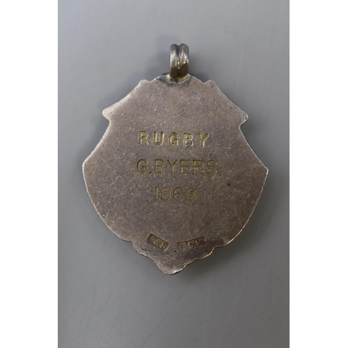 6 - A Hallmarked Birmingham Silver Rugby Medal, 'MPSSC; Rugby G.Byers 1968'.