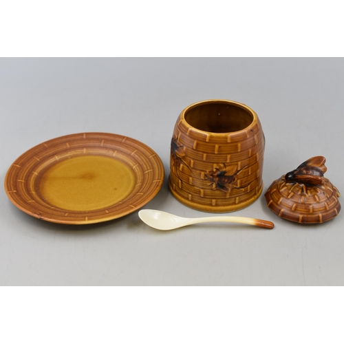 135 - A Ceramic Honey Pot With Matching Spoon and Side Plate.