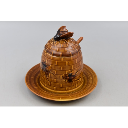 135 - A Ceramic Honey Pot With Matching Spoon and Side Plate.