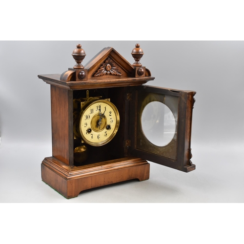 179 - An Antique Junghens Mantle Clock in Walnut, With Key and Pendulum. Approx 14