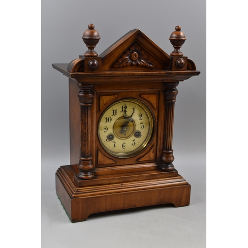 179 - An Antique Junghens Mantle Clock in Walnut, With Key and Pendulum. Approx 14