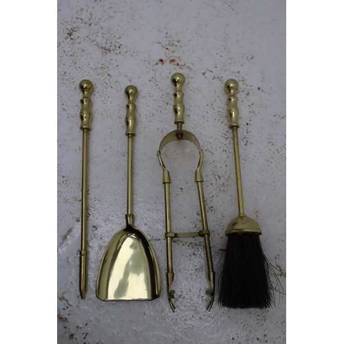 192 - A Four Piece Brass Companion Set, With A Brass Fire Front.