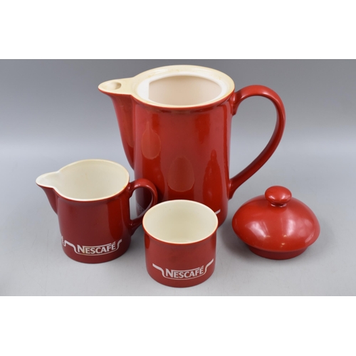 214 - A Twenty-Four Piece Ceramic Nescafe Coffee/ Breakfast Set.