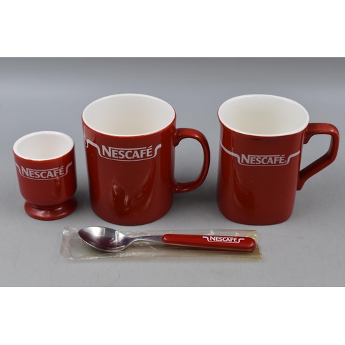 214 - A Twenty-Four Piece Ceramic Nescafe Coffee/ Breakfast Set.