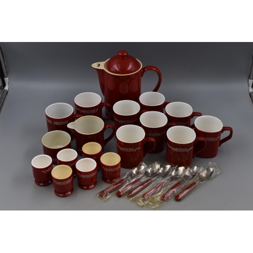 214 - A Twenty-Four Piece Ceramic Nescafe Coffee/ Breakfast Set.