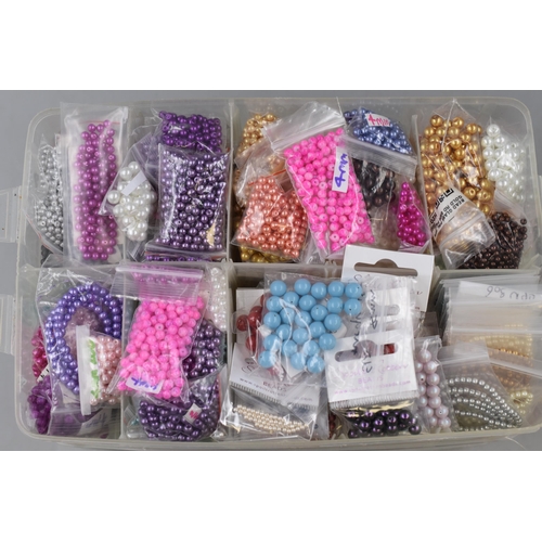 267 - LARGE Collection of Pre-Drilled Crafting Beads in a Three Tier Sectional Storage Case .