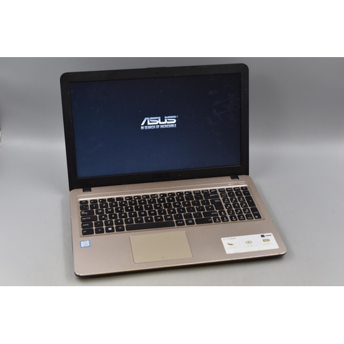 305 - Asus VivoBook Laptop with Power Lead. Powers on When Tested.