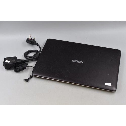 305 - Asus VivoBook Laptop with Power Lead. Powers on When Tested.