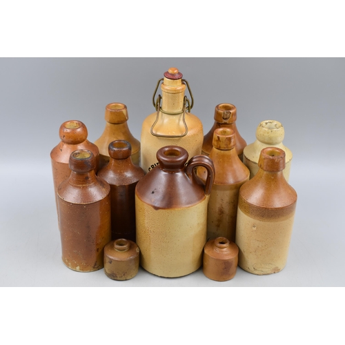 325 - A Selection of Ten Salt Glazed Stoneware Bottles, And Two Ink Bottles. Includes Cripple Cock, Jewsbu... 