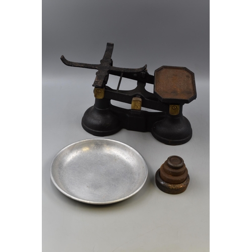 246 - A Set of Cast Iron and Brass Scales With a Selection of Four Weights.