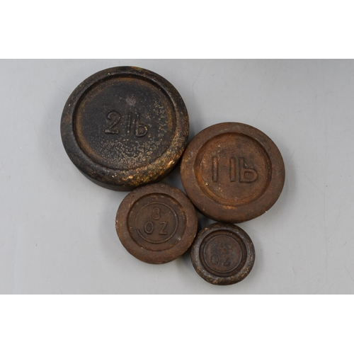 246 - A Set of Cast Iron and Brass Scales With a Selection of Four Weights.