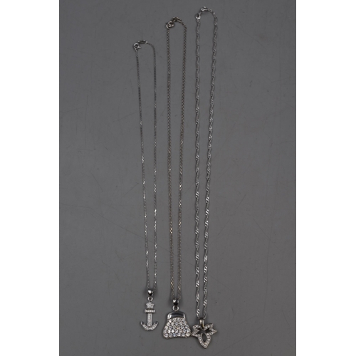 27 - Selection of Three Silver 925 Pendant Necklaces on Silver 925 Chains. Includes Handbag, Anchor and L... 