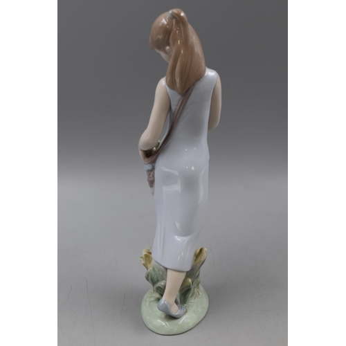 215 - A Lladro Girl With Tulips Ceramic Figure, Approx 9