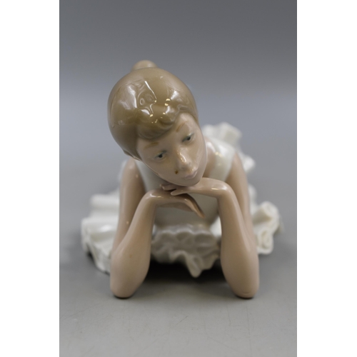 218 - Two Nao by Lladro Figures, one Boy with Pillow and a Ballerina Girl. Largest approx. 10” High