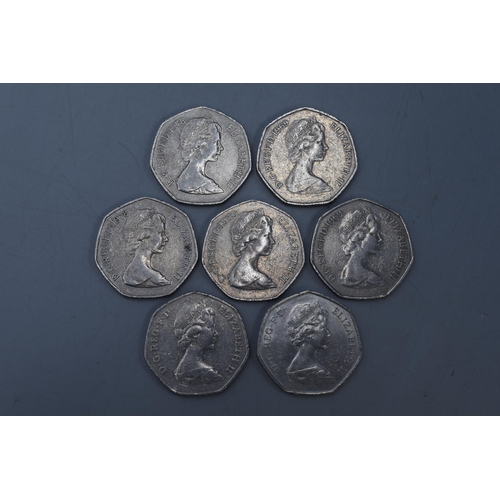 151 - A Selection of Seven Collectable Old 50p Coins.