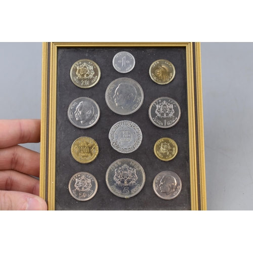 156 - A Framed And Glazed Set of Moroccan Coins.