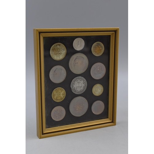 156 - A Framed And Glazed Set of Moroccan Coins.