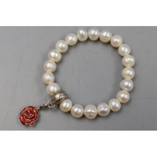 33 - A Thomas Sabo Pearl Bracelet With 925 Silver Rose Charm. In Presentation Box.