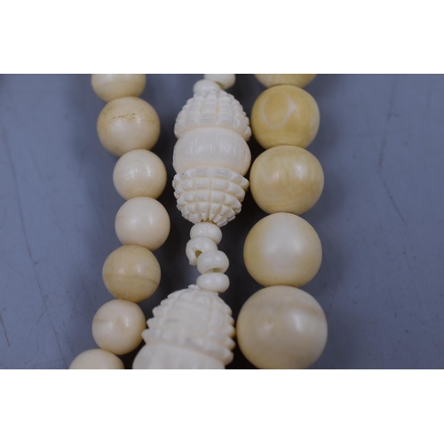 85 - Two Bone necklaces and a elasticated Bracelet