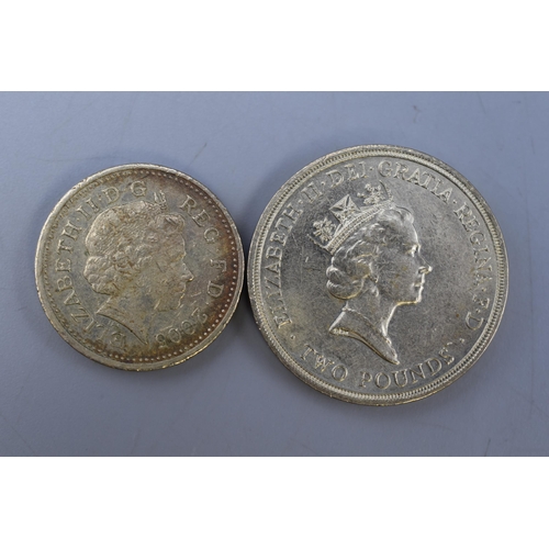 127 - Two Collectable UK Coins. Includes 1986 Scottish Thistle Two Pound Coin and 2005 One Pound Coin.