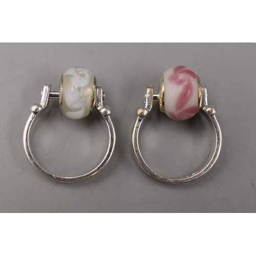 67 - Two Pandora 925. Silver 'Bead It' Rings, With White and Pink Charms. In Presentation Box.