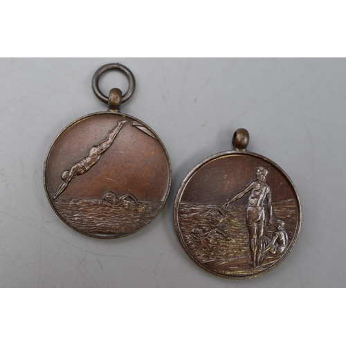 69 - Two Vintage Bronze Swimming Medals.