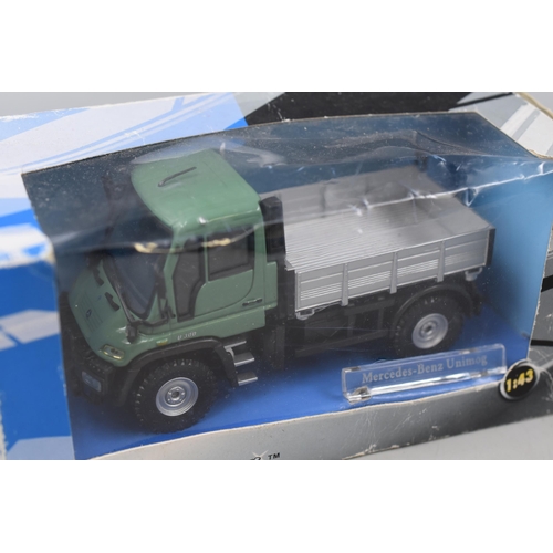 368 - Two Boxed Cararama Die-cast Collectors Vehicles to include a Mercedes-Benz Unimog and a Renault traf... 