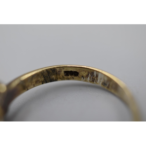 6 - A Gold Tone Clear Stoned Ring, Marked To Interior. Size P.