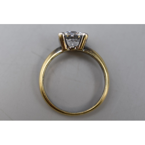 6 - A Gold Tone Clear Stoned Ring, Marked To Interior. Size P.