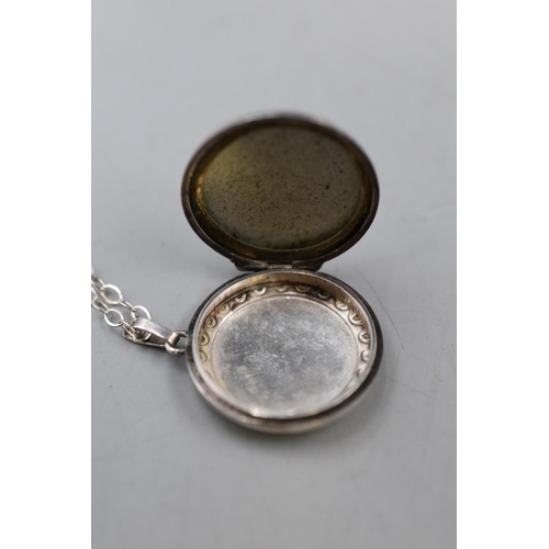 29 - An Etched Silver Locket on 925. Silver Chain.