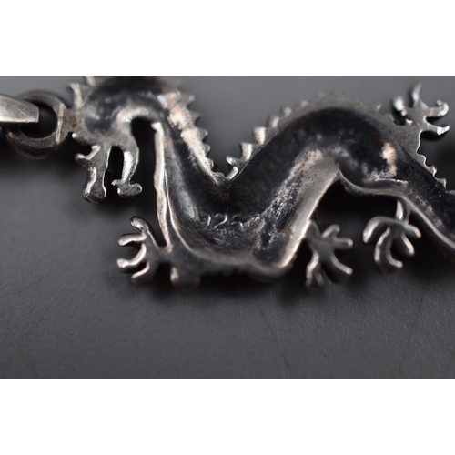 42 - A 925. Silver Oriental Dragon Pendant on 925. Silver Chain, With a Pair of 925. Silver Jade Effect O... 