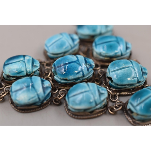 50 - A Hallmarked Egyptian Silver Ten Scarab Beetle Necklace.