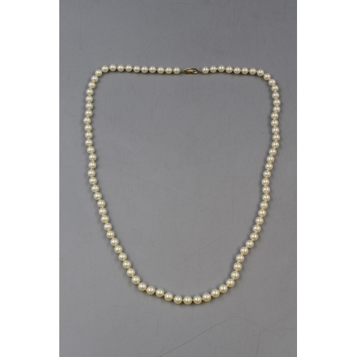 56 - A Faux Pearl Christian Dior Gold Tone Clasped Necklace, In Christian Dior Pouch