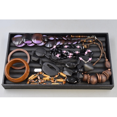 86 - A Selection of Assorted 70's and 80's Jewellery. Includes Wooden Bangles and Beaded Necklaces.