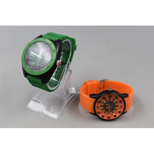 67 - Two Brand New Ex-Display Adidas Rubber Strapped Sports Watches one with Display Stand.