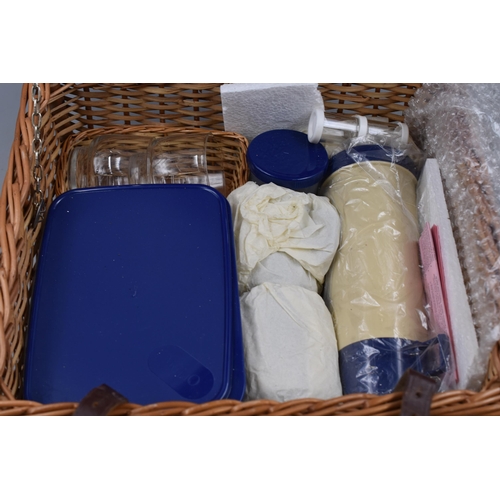 662 - An Optima Wicker Picnic Hamper complete with contents