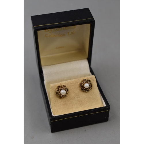 55 - A Pair of 9ct Gold Pearl Stoned Flower Stud Earrings, In Presentation Box.