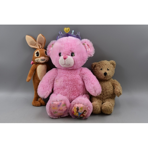 675 - A Selection of Three Soft Toys. Includes Harrods Knightsbridge Teddy Bear, Disney Princess Build-A-B... 