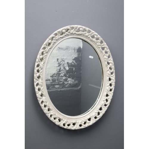 686 - A Wall Hanging Wooden Framed Oval Mirror, Approx 25