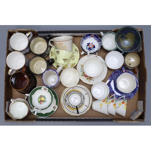 693 - A Large Selection of Mixed Ceramic Cups and Saucers. Includes Ringtons, Adderley, Paragon, Royal Gra... 