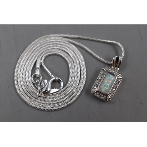 51 - An Art Deco Style Opal and Clear Stoned 925. Silver Pendant, On 925. Silver Chain. In Presentation B... 