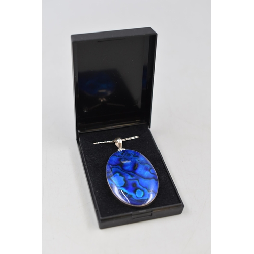 54 - A Large Abalone Shell and 925. Silver Pendant, On 925. Silver Chain. In Presentation Box. Width Appr... 