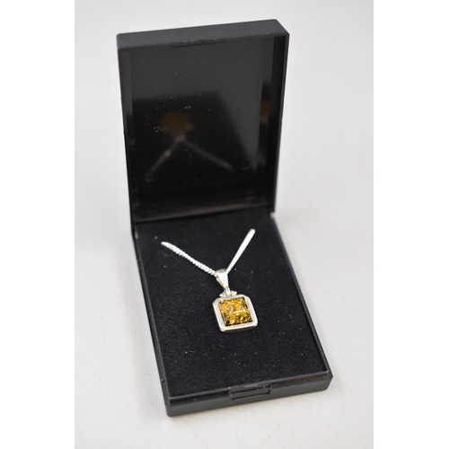 56 - A 925. Silver Amber Stoned Pendant, On 925. Silver Chain. In Presentation Box.