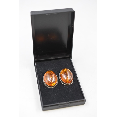 59 - A Pair of Unmarked Silver Amber Clip on Earrings, In Presentation Box.