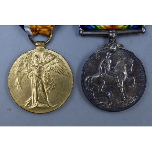 181 - A Boxed WWI Medal Pair, Awarded To PTE A. Rimmer. With Bullet Casing.