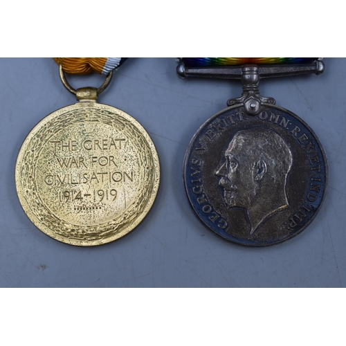 181 - A Boxed WWI Medal Pair, Awarded To PTE A. Rimmer. With Bullet Casing.