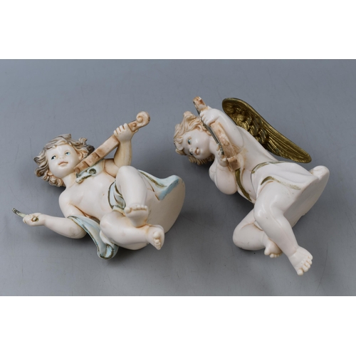 267 - Pair of Vintage Resin Italian Cherub Piano Babies, One Missing Wings. Approx 6